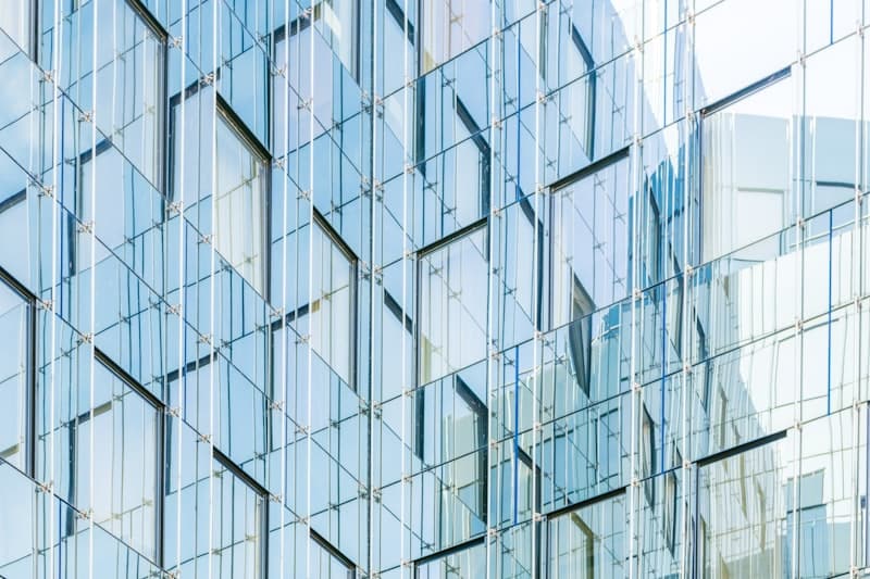 Architectural glass facade with reflective panels